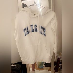 White hoodie that says tailgate